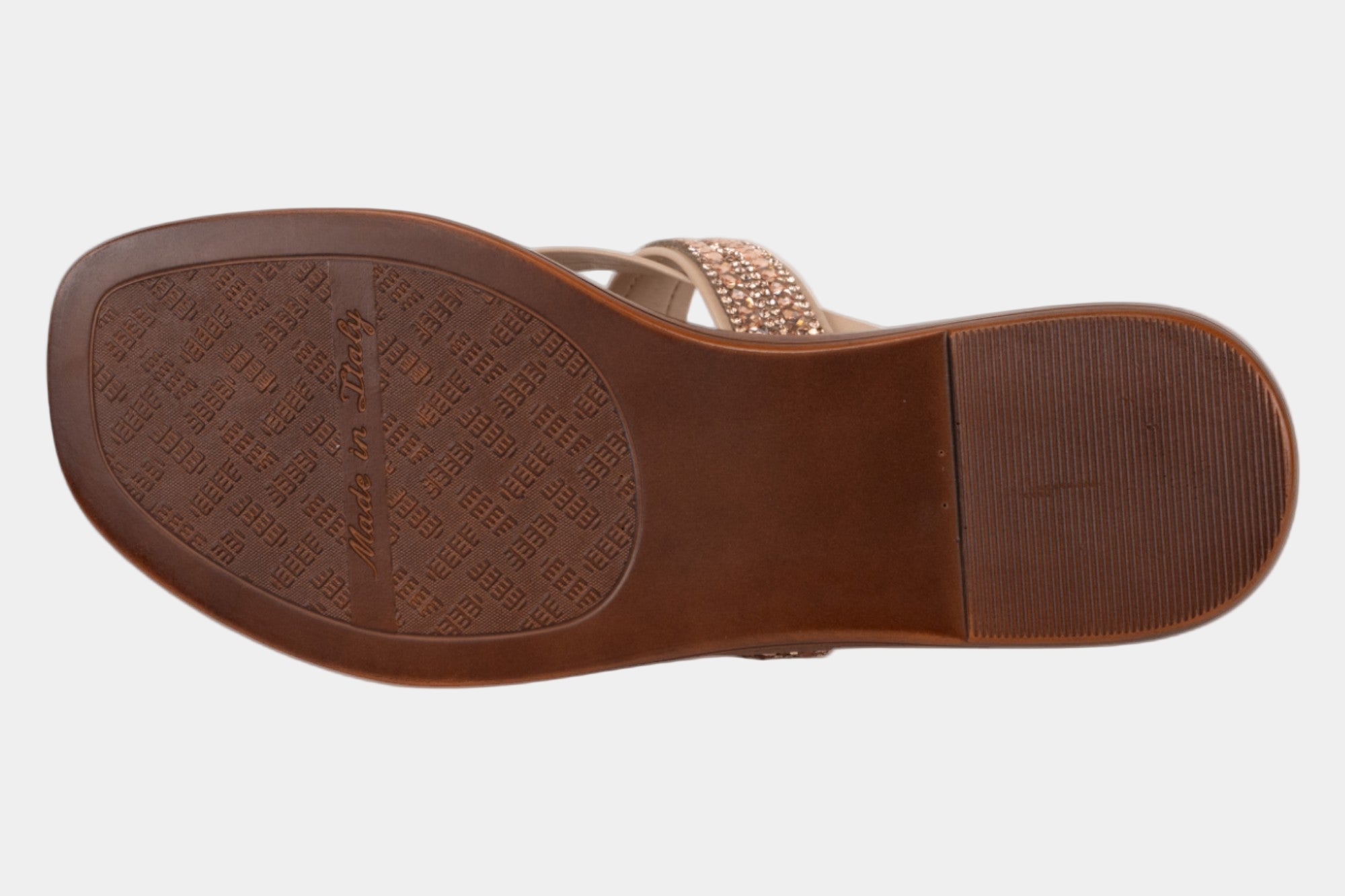 Brown sandal sole with textured pattern on a white background
