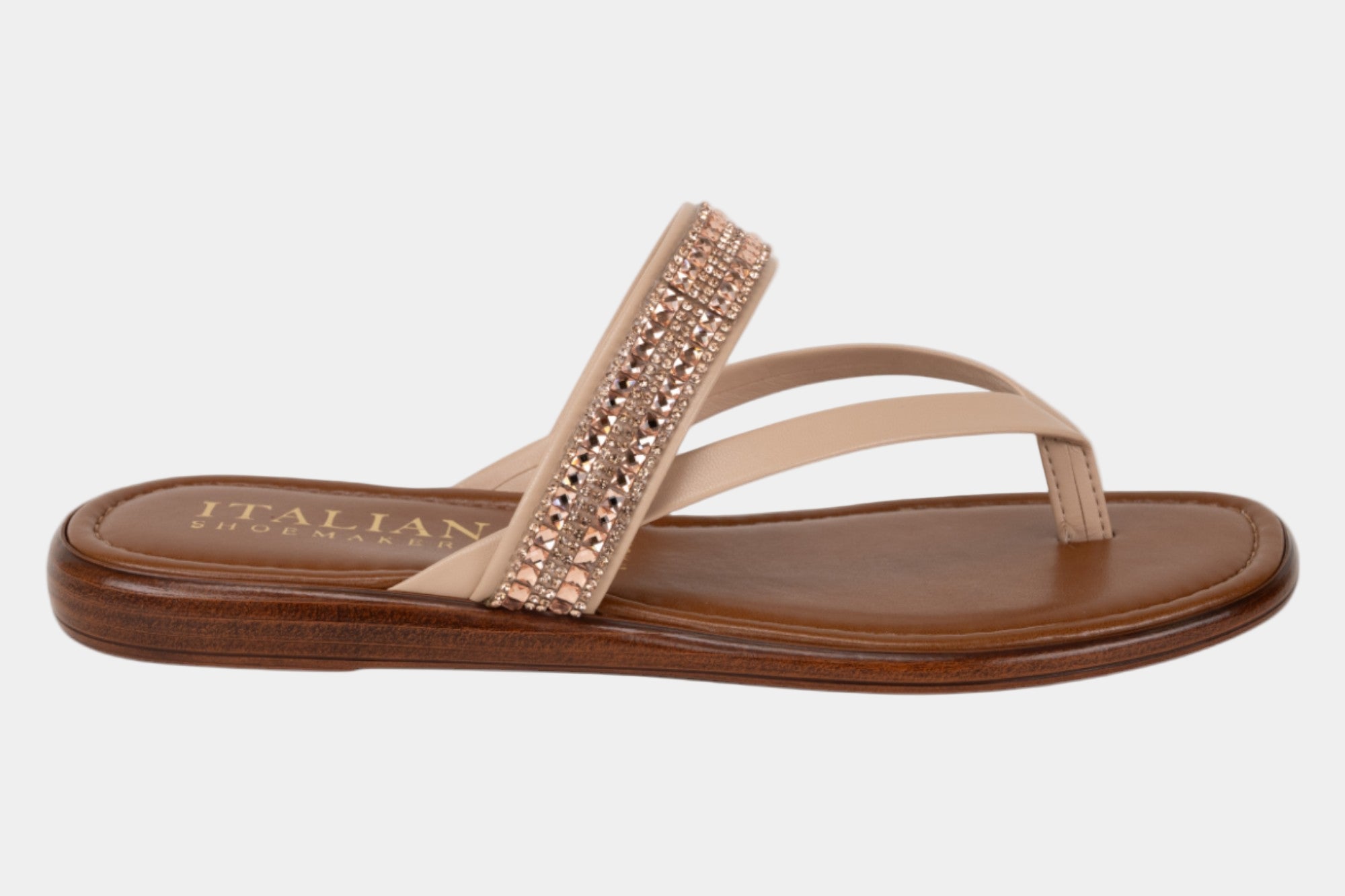 Beige sandal with brown sole on a white background